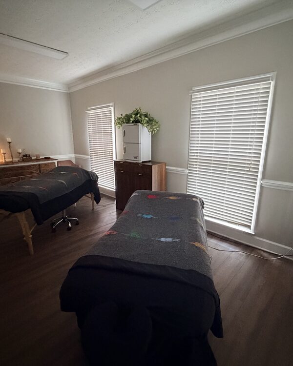 Treatment room with two tables and natural light